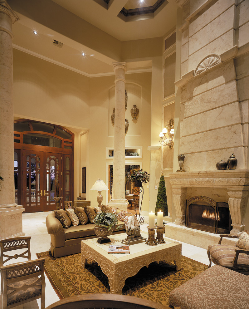 Inspiration for a large mediterranean formal open plan living room in Miami with beige walls, travertine flooring, a standard fireplace, a stone fireplace surround and no tv.