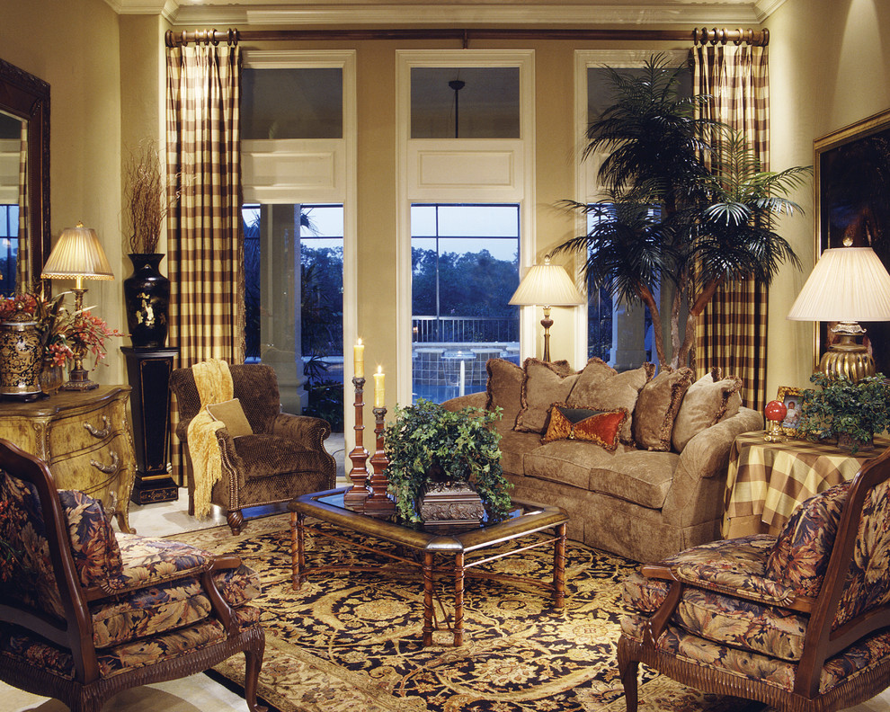 Large tuscan formal and enclosed travertine floor living room photo in Miami with beige walls, no fireplace and no tv