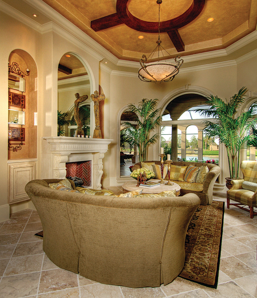 Example of a large tuscan formal and open concept travertine floor living room design in Miami with beige walls, a standard fireplace, a stone fireplace and no tv