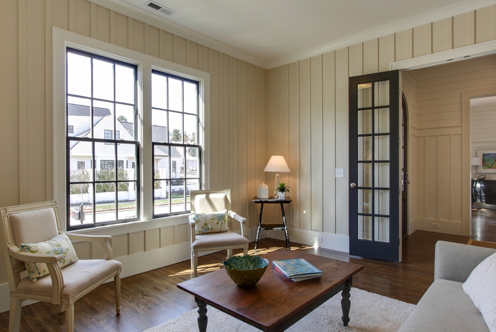 Photo of a traditional living room in Raleigh with beige walls.