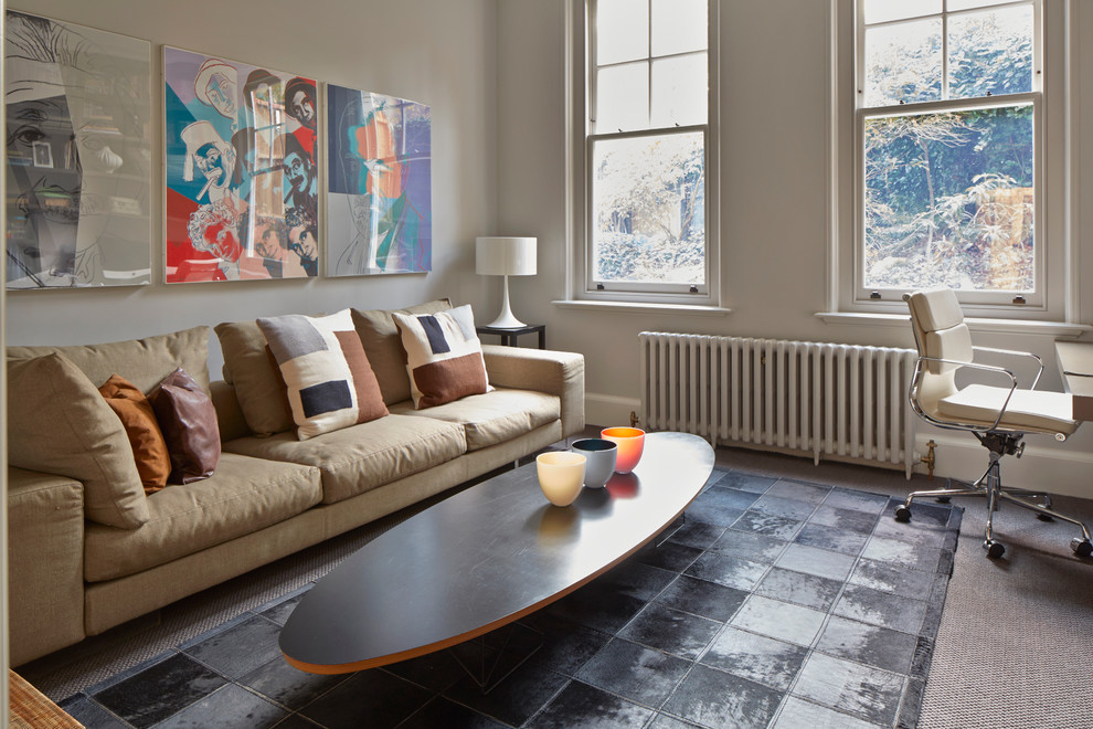 Inspiration for a large scandinavian formal carpeted living room remodel in London with gray walls and no fireplace