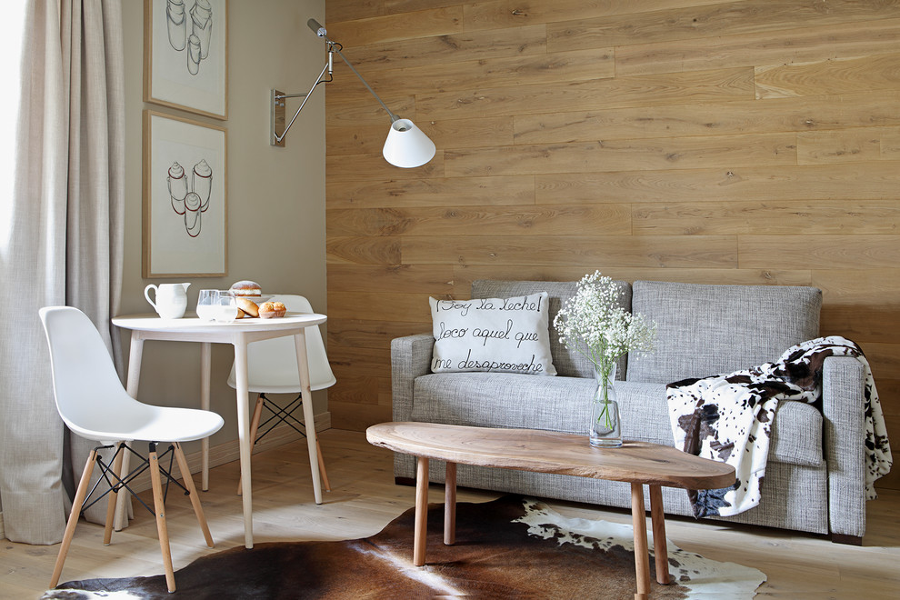 Inspiration for a mid-sized scandinavian formal and open concept light wood floor living room remodel in Other with beige walls, no fireplace and no tv