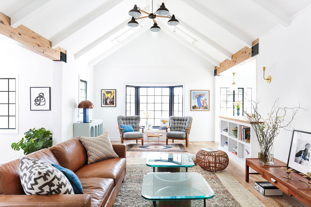 Living room - large scandinavian open concept light wood floor living room idea in Los Angeles with white walls, no tv and no fireplace