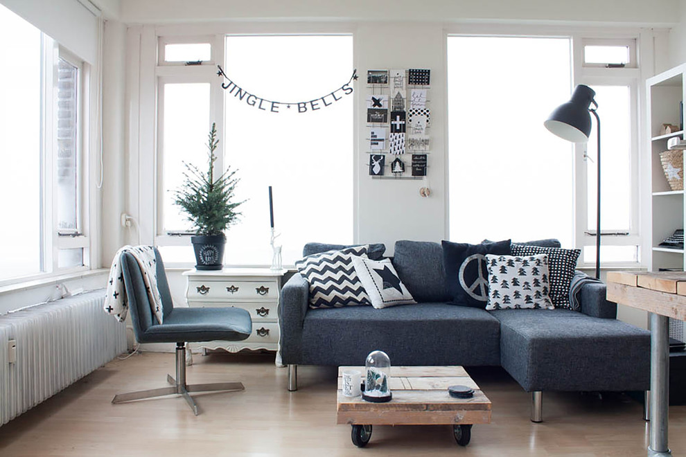Inspiration for a scandinavian living room remodel in Amsterdam with white walls, no fireplace and no tv