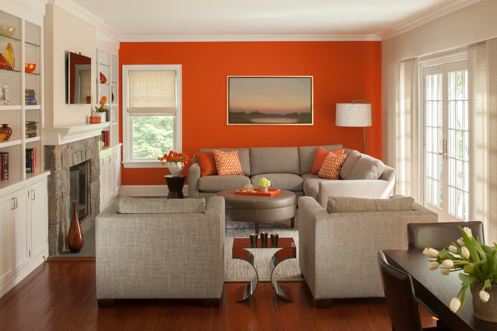 Living room - modern enclosed medium tone wood floor living room idea in New York with a standard fireplace, a stone fireplace and a wall-mounted tv