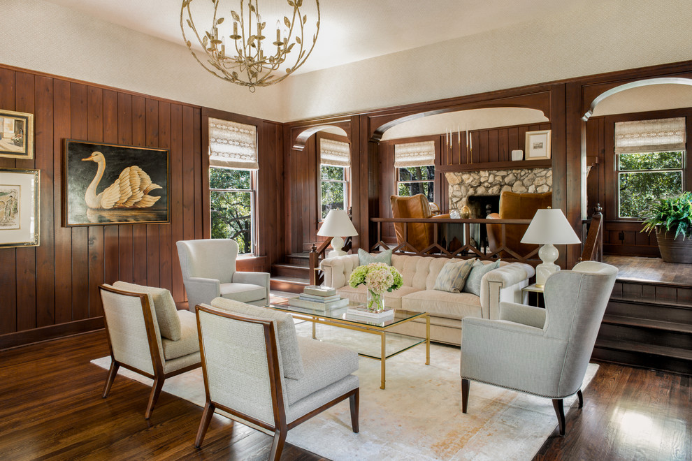 Traditional formal living room in Austin with brown walls, dark hardwood flooring and brown floors.