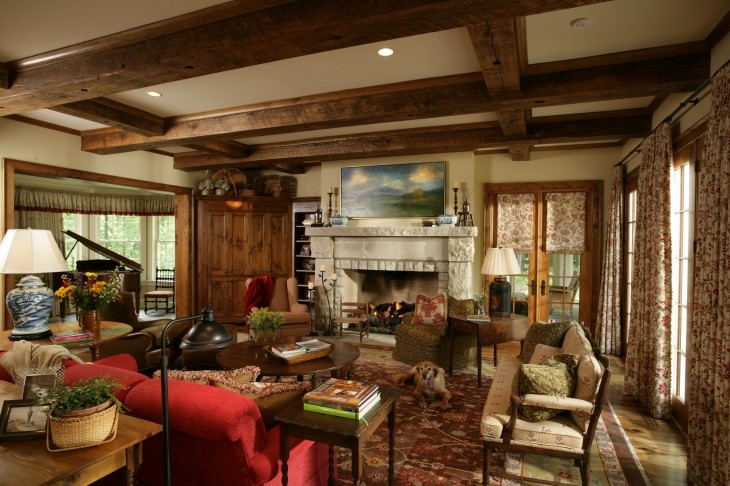 Large rustic enclosed living room in Other with beige walls, a standard fireplace, no tv, medium hardwood flooring and a concrete fireplace surround.