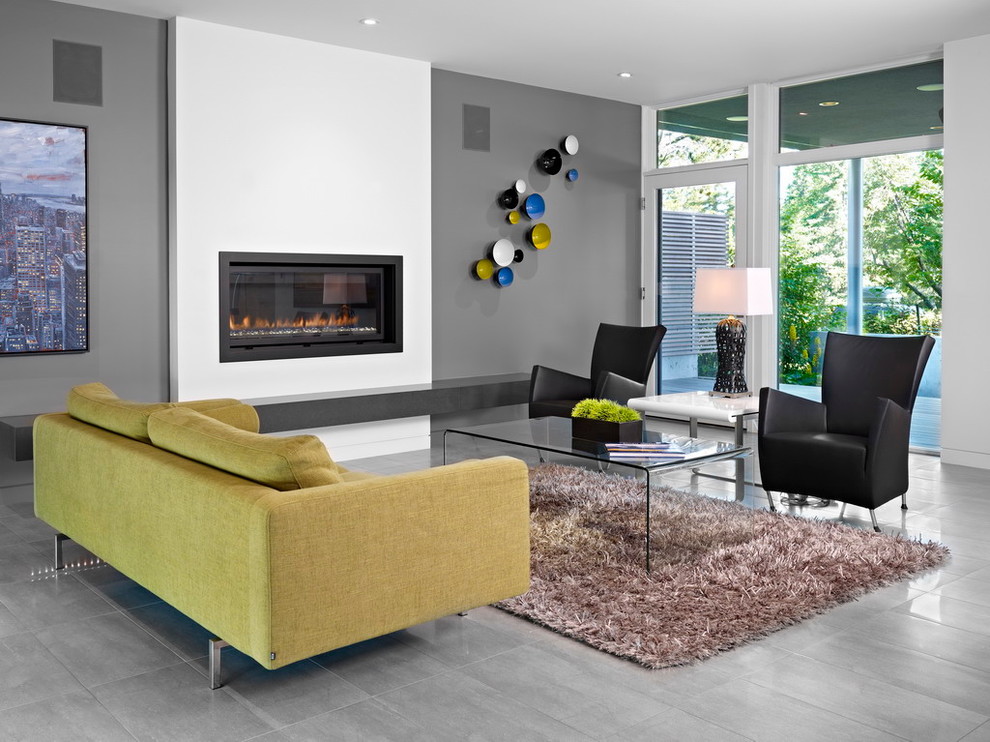 Esempio di un soggiorno moderno con pareti grigie, pavimento in gres porcellanato e pavimento grigio