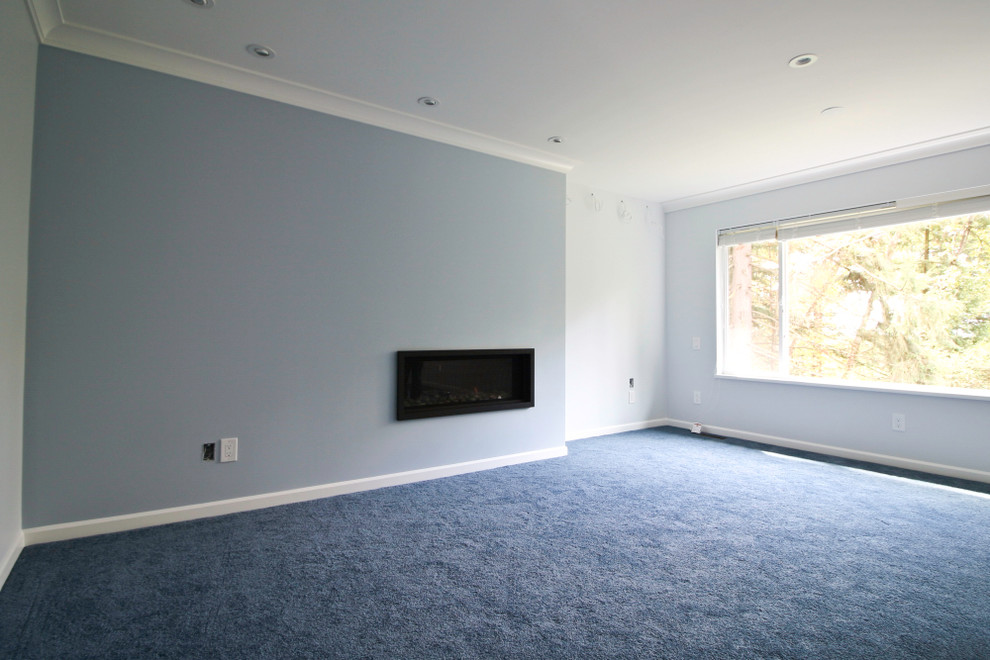 Idéer för mellanstora separata vardagsrum, med blå väggar, heltäckningsmatta, ett finrum, en hängande öppen spis och en spiselkrans i metall