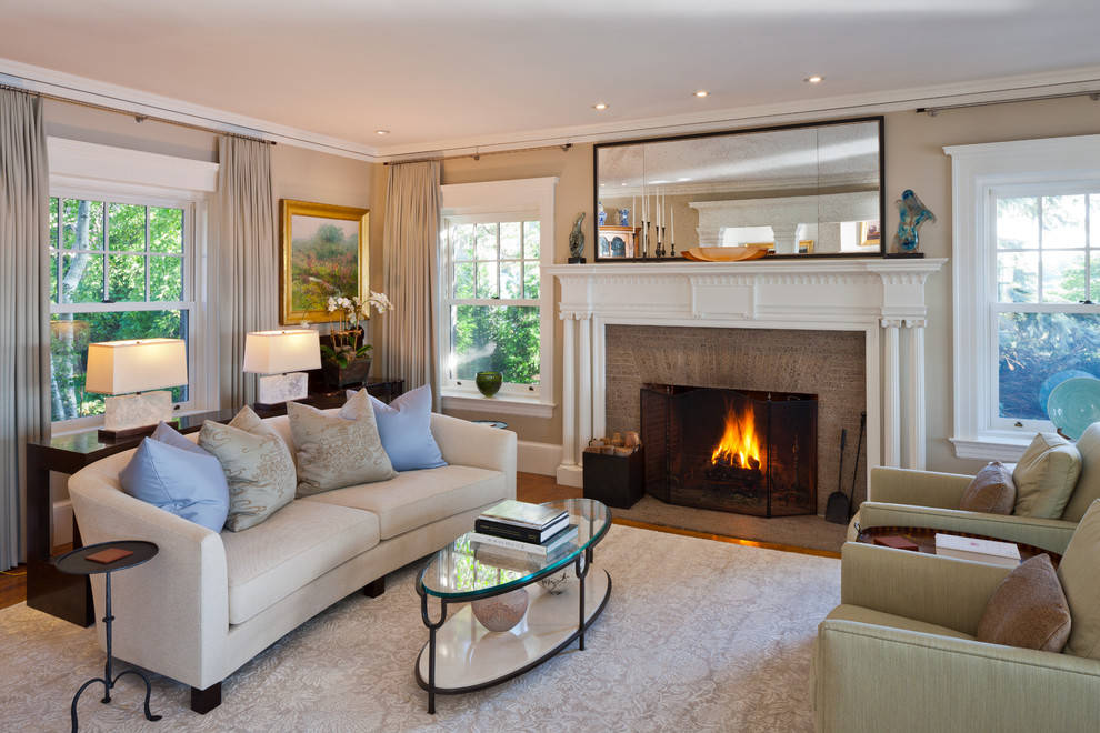 Design ideas for a medium sized classic formal open plan living room in Boston with beige walls, dark hardwood flooring, a standard fireplace and a brick fireplace surround.