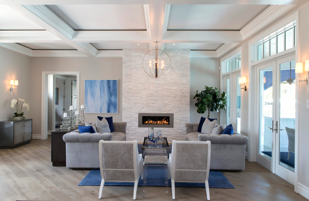Example of a large trendy living room design in Miami with a stone fireplace, gray walls and a ribbon fireplace