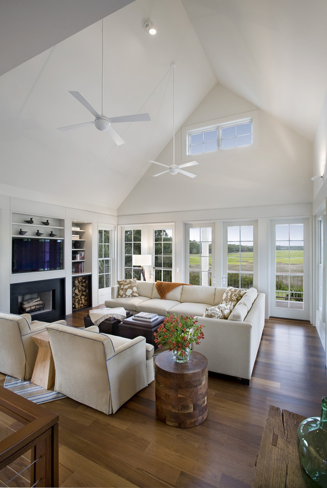 Photo of a contemporary open plan living room in Charleston with a built-in media unit.