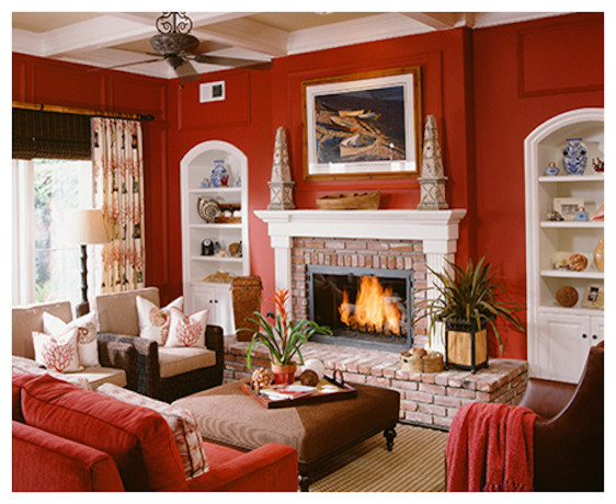 На фото: парадная, изолированная гостиная комната среднего размера в современном стиле с красными стенами, ковровым покрытием, стандартным камином и фасадом камина из кирпича