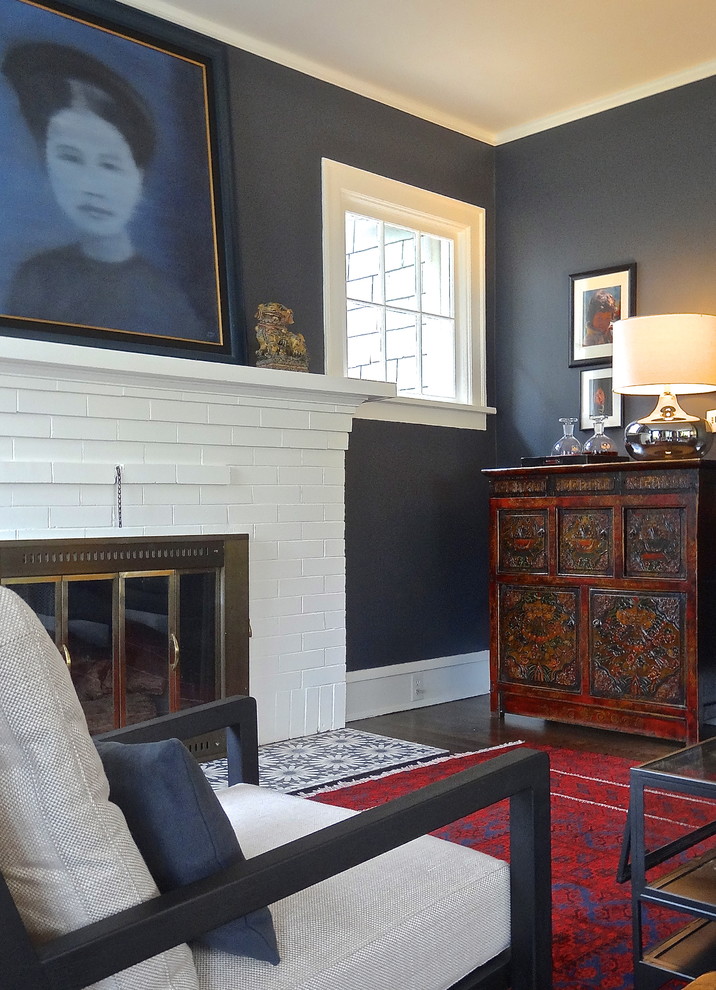 Eclectic dark wood floor living room photo in Seattle with gray walls, a standard fireplace and a brick fireplace