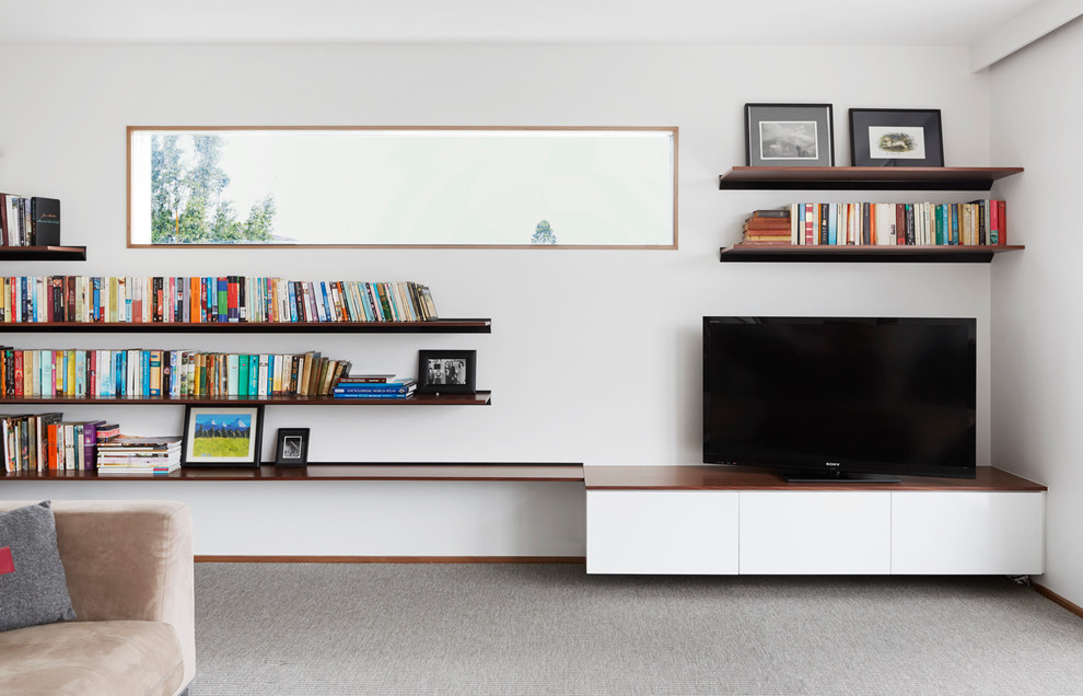Inspiration för moderna vardagsrum, med ett bibliotek och vita väggar