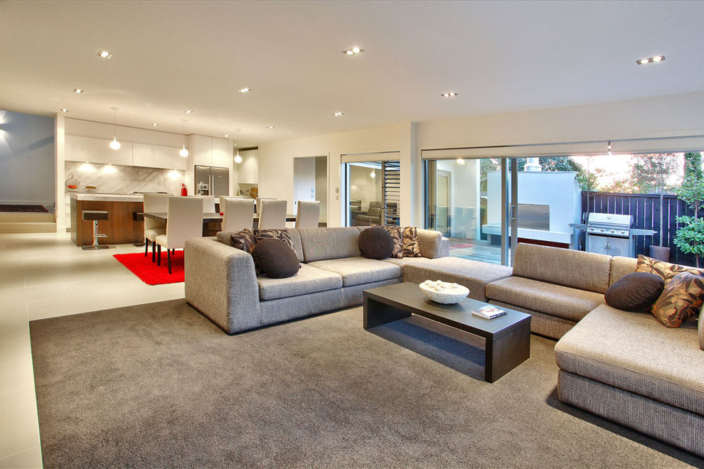 Immagine di un grande soggiorno minimal aperto con pavimento con piastrelle in ceramica