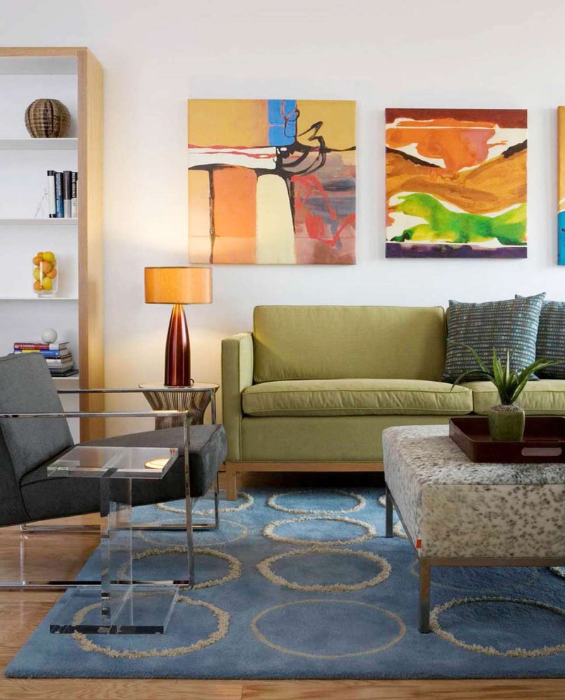 This is an example of an eclectic living room in DC Metro with white walls.