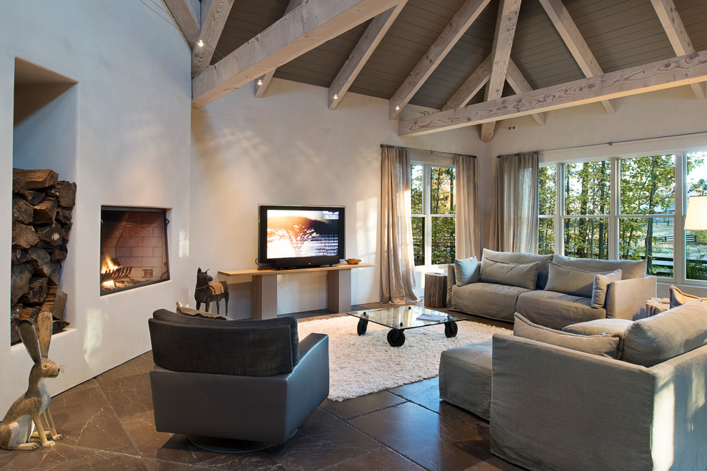 На фото: гостиная комната в современном стиле с угловым камином и красивыми шторами с
