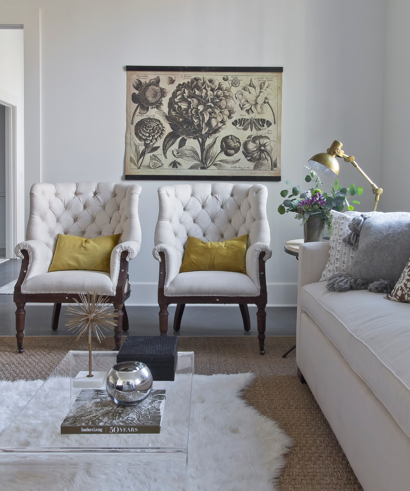 Example of a small danish loft-style concrete floor living room design in Atlanta with white walls, no fireplace and no tv