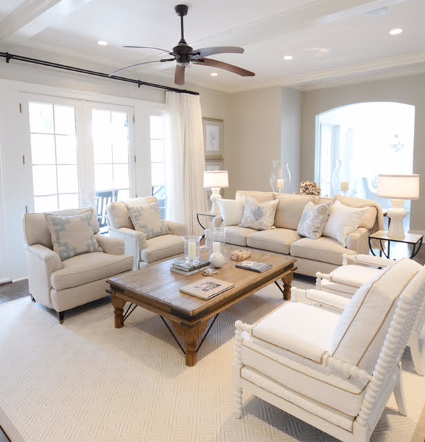 Design ideas for a medium sized coastal formal enclosed living room in Charleston with beige walls, carpet, no tv and feature lighting.