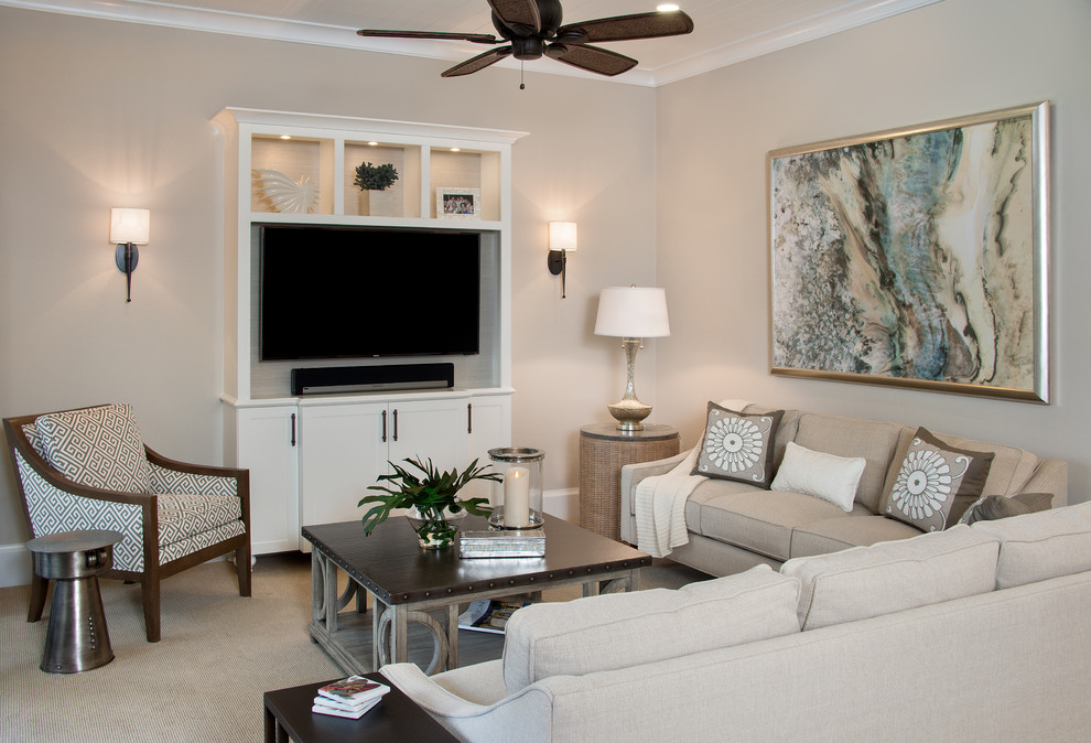 Example of a small beach style open concept carpeted living room design with beige walls and a wall-mounted tv
