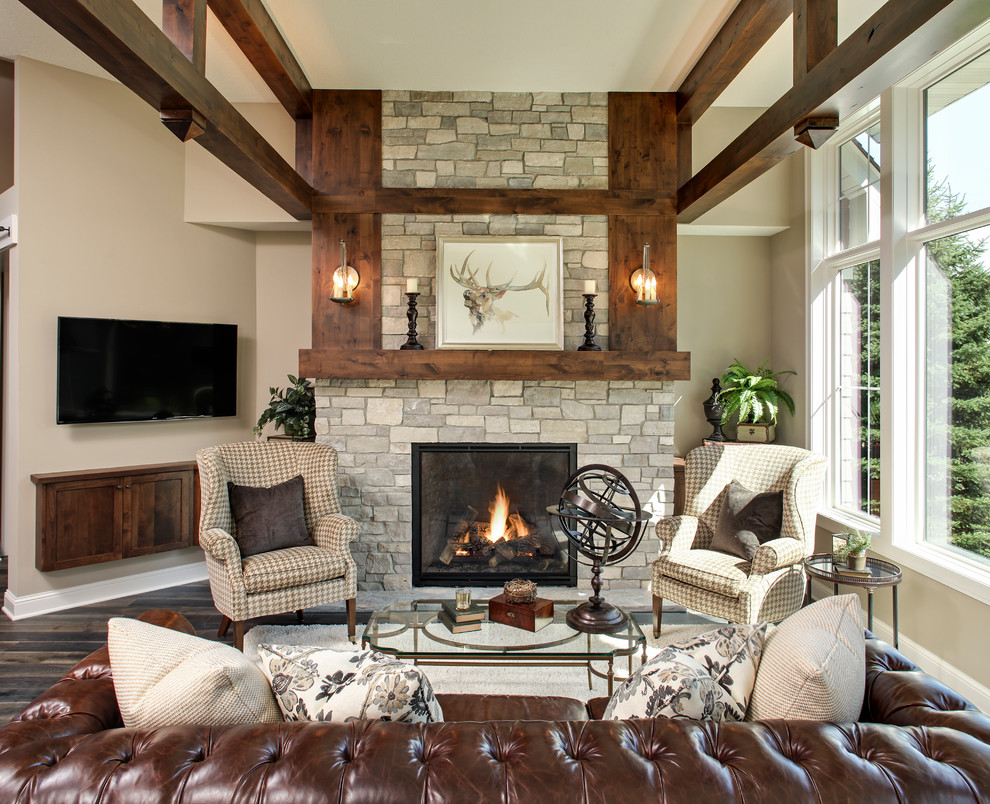 Inspiration for a medium sized rustic open plan living room in Minneapolis with beige walls, medium hardwood flooring, a standard fireplace, a brick fireplace surround and a wall mounted tv.