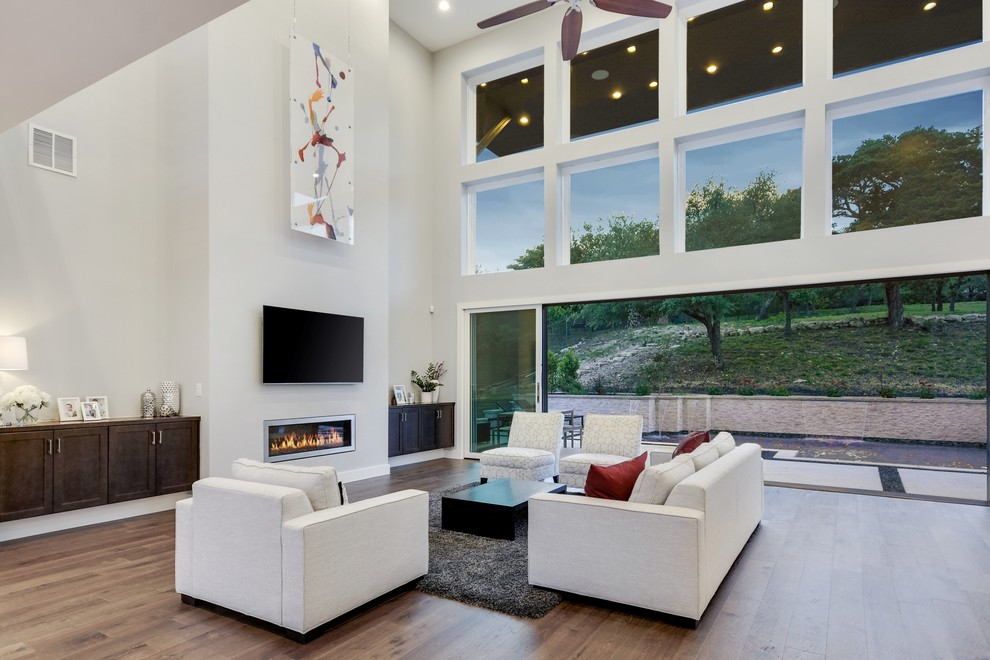 This is an example of a large traditional living room in Austin.