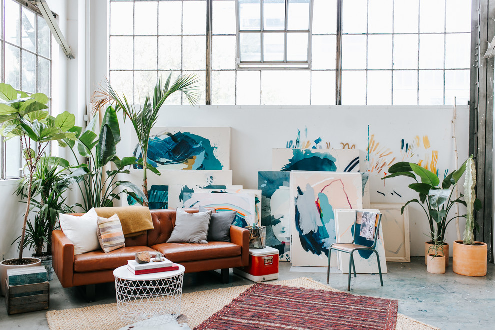 Inspiration for an urban living room in San Francisco with white walls, no fireplace and grey floors.