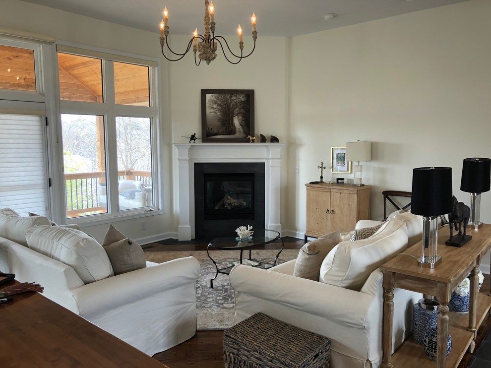 Example of a large transitional open concept dark wood floor and brown floor living room design in Omaha with yellow walls, a corner fireplace and a tile fireplace