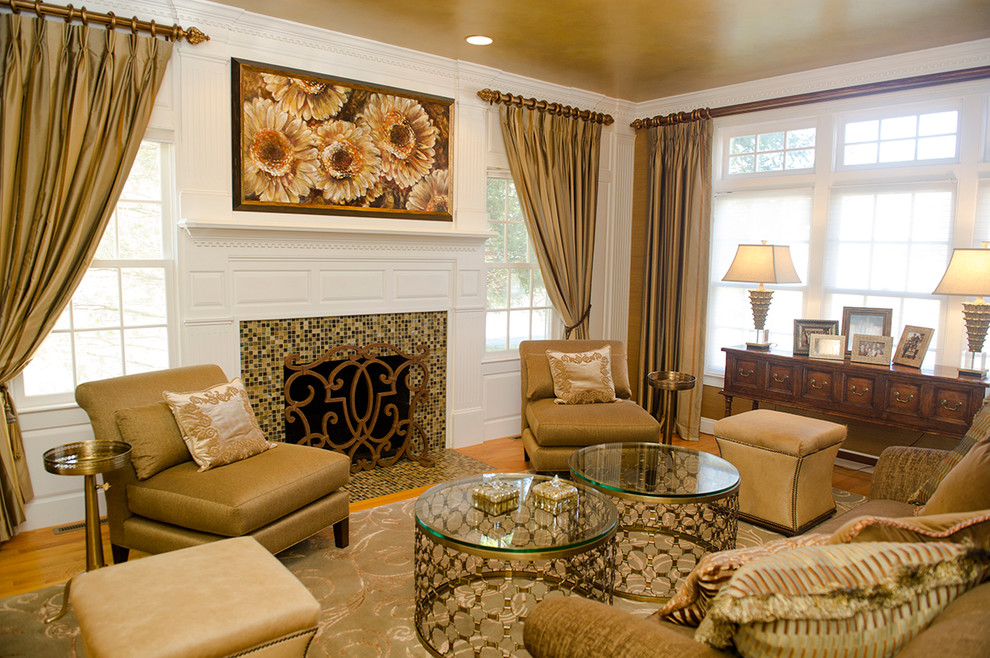 Photo of a large classic formal open plan living room in Boston with white walls, medium hardwood flooring, a standard fireplace, a tiled fireplace surround and no tv.