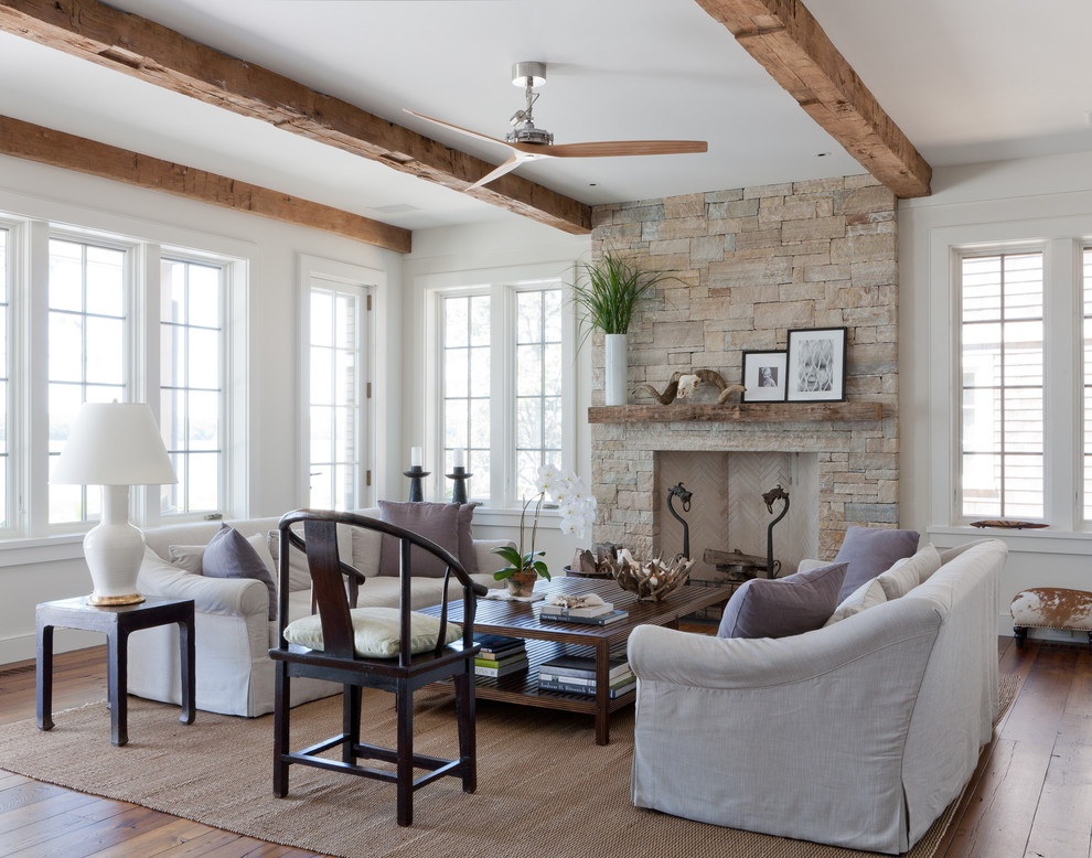 Inspiration for a coastal living room remodel in New York with a stone fireplace