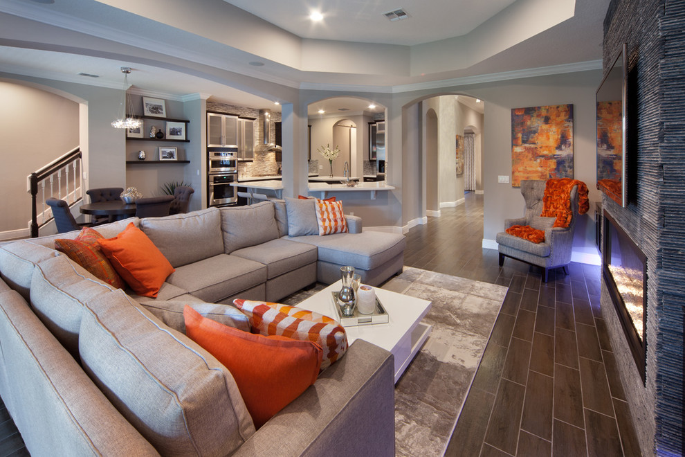 Design ideas for a medium sized classic open plan living room in Orlando with grey walls, porcelain flooring, a ribbon fireplace, a stone fireplace surround and a wall mounted tv.