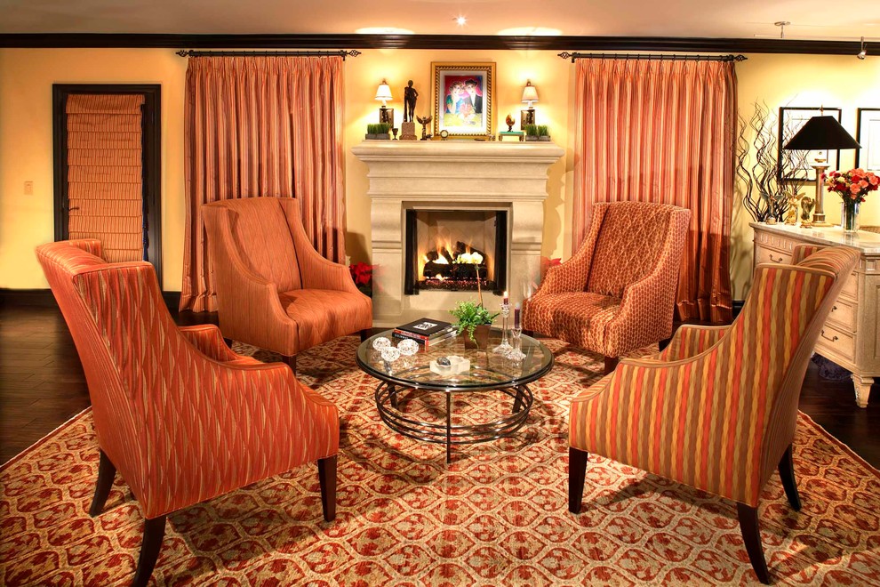 Living room - transitional open concept dark wood floor living room idea in Los Angeles with yellow walls, a standard fireplace and a stone fireplace