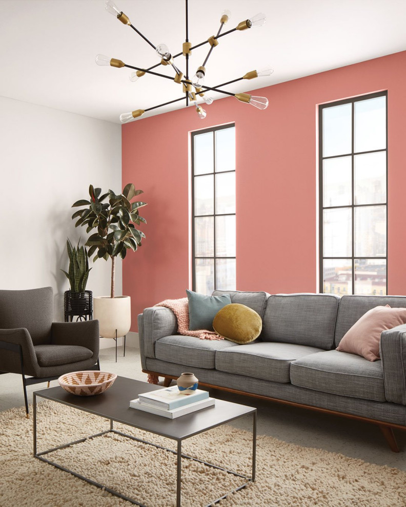 Идея дизайна: большая открытая гостиная комната в современном стиле с розовыми стенами, бетонным полом и серым полом без камина, телевизора