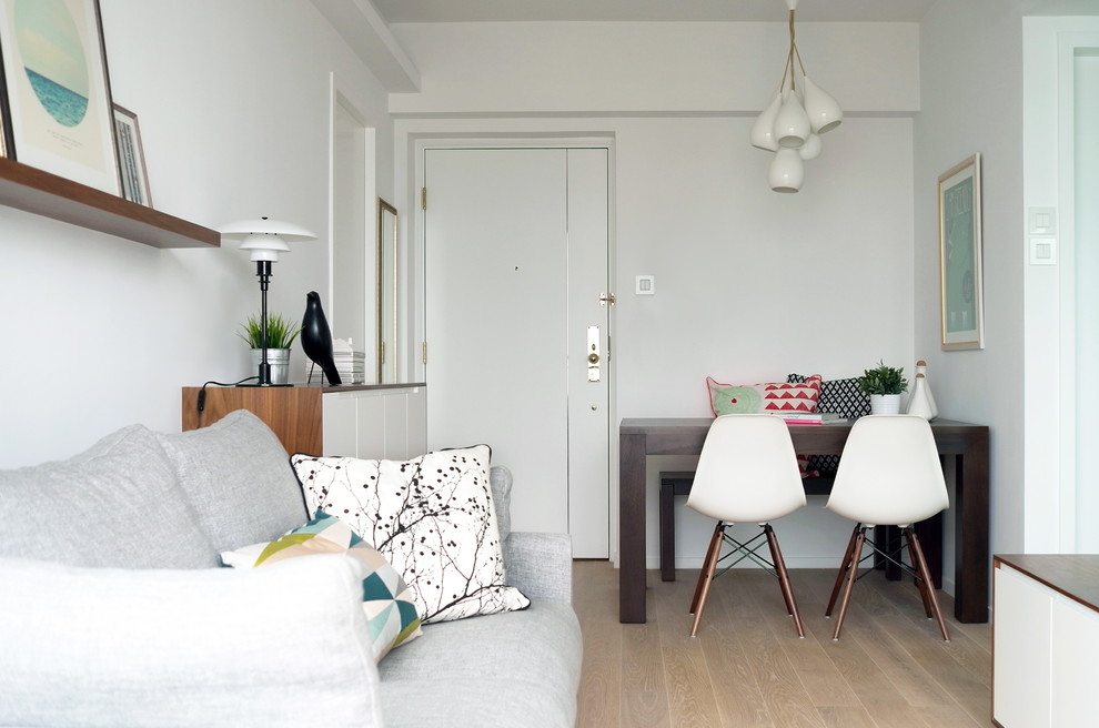 Example of a small minimalist living room design in Hong Kong with white walls