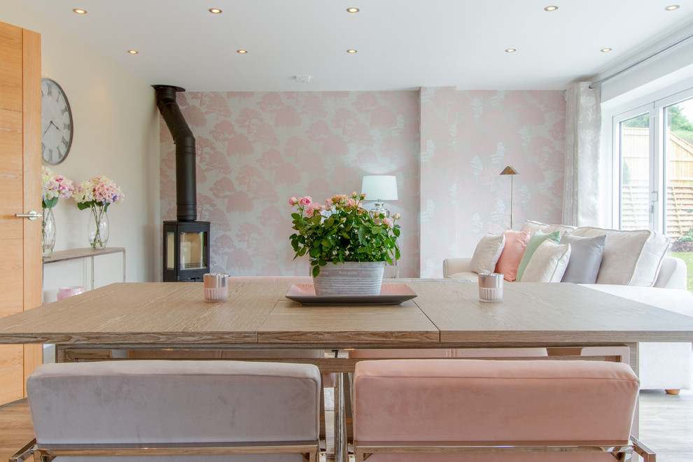 Photo of a contemporary living room in Gloucestershire with pink walls.