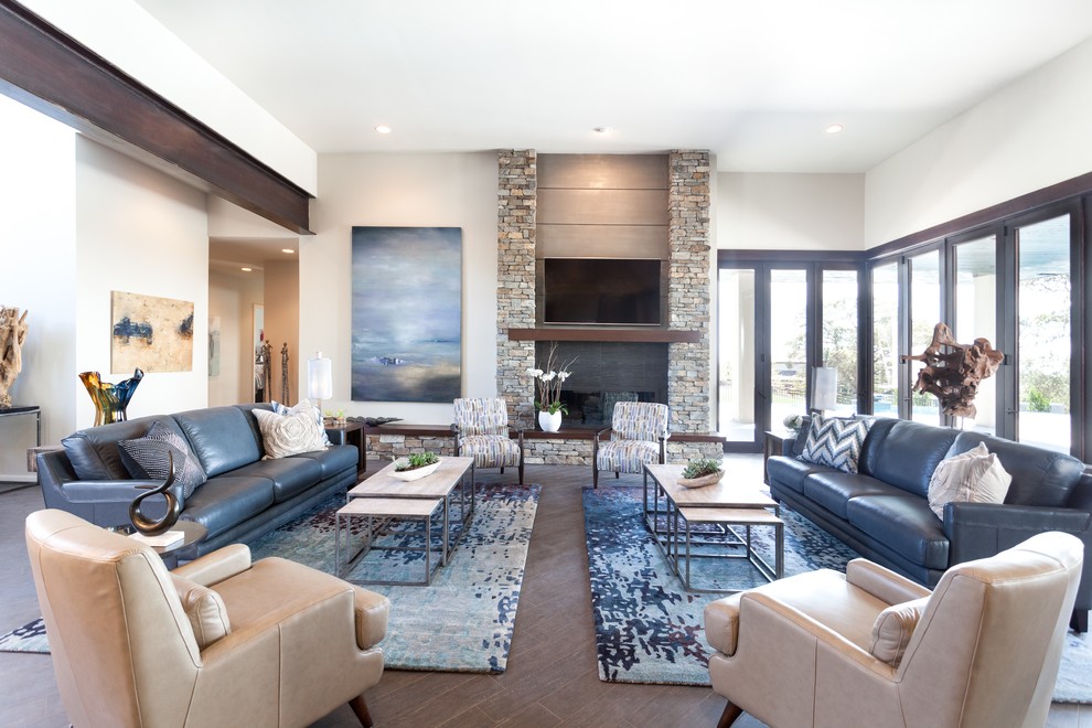 This is an example of a large modern open plan living room in Sacramento with grey walls, porcelain flooring, a standard fireplace and a stone fireplace surround.