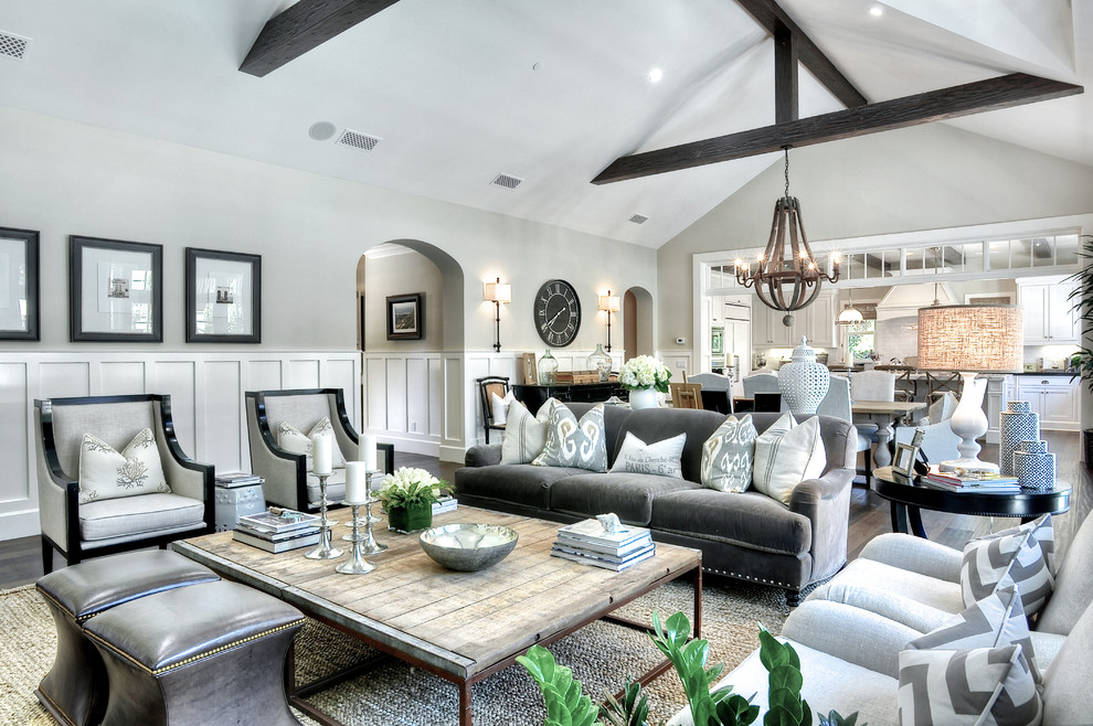 Inspiration for a large classic formal open plan living room in Orange County with grey walls, dark hardwood flooring, no tv, a standard fireplace and a stone fireplace surround.