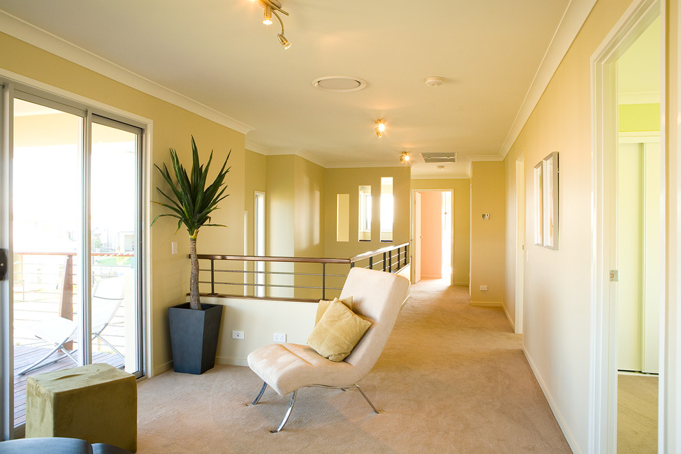 Photo of a small contemporary mezzanine living room in Brisbane with a reading nook, beige walls and carpet.