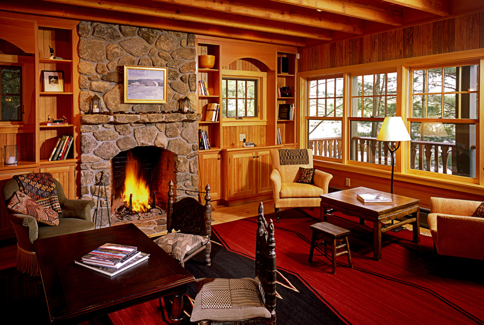 Inspiration for a large rustic open plan living room in Boston with brown walls, light hardwood flooring, a standard fireplace, a stone fireplace surround and no tv.