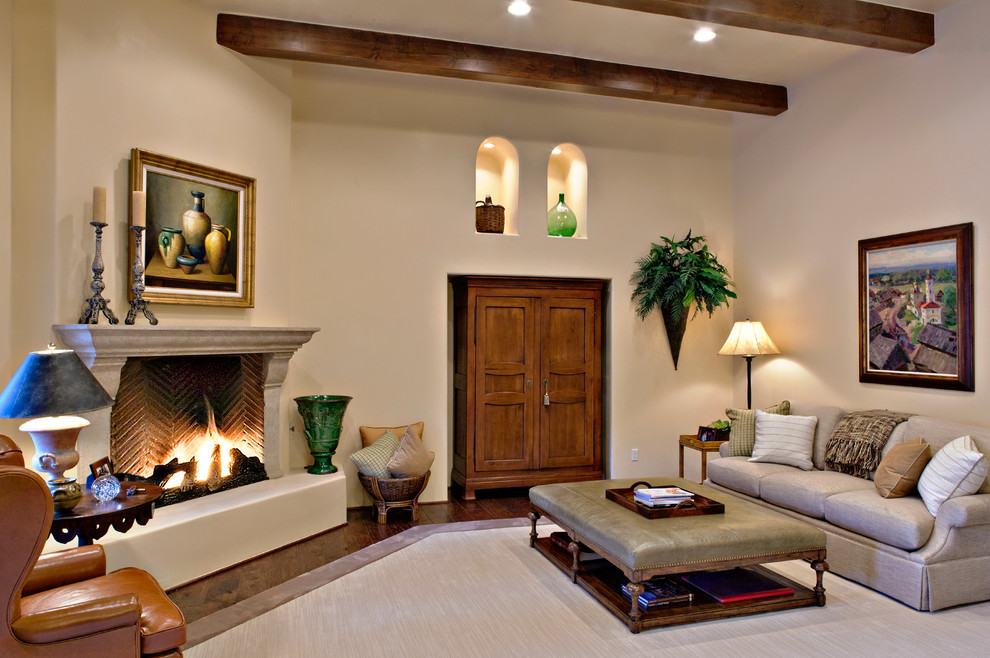 Inspiration for a large mediterranean enclosed carpeted living room remodel in Phoenix with beige walls, a corner fireplace and no tv
