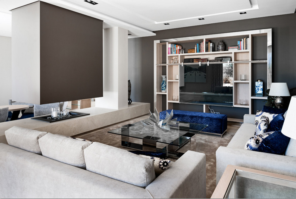 Inspiration for a contemporary living room remodel in DC Metro with gray walls and a concealed tv