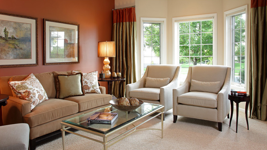 Inspiration for a mid-sized transitional open concept carpeted living room remodel in Minneapolis with orange walls