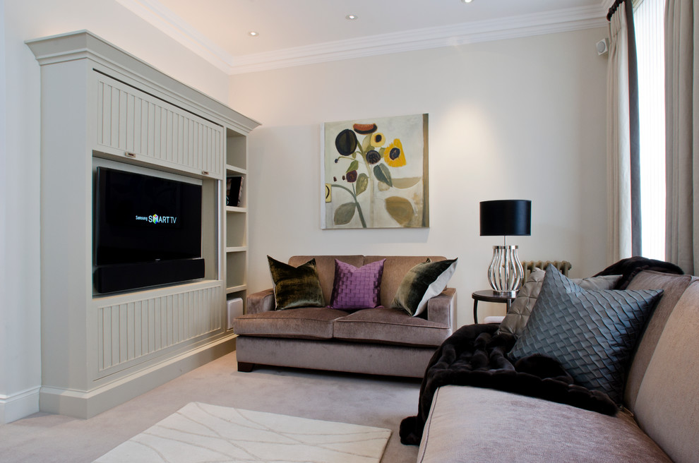 Traditional living room in London with a stone fireplace surround and a concealed tv.