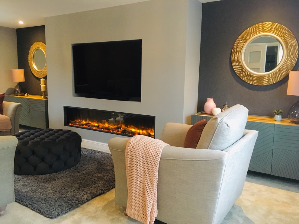 Inspiration for a medium sized contemporary formal enclosed living room in Buckinghamshire with grey walls, carpet, a standard fireplace, a plastered fireplace surround, a built-in media unit and grey floors.