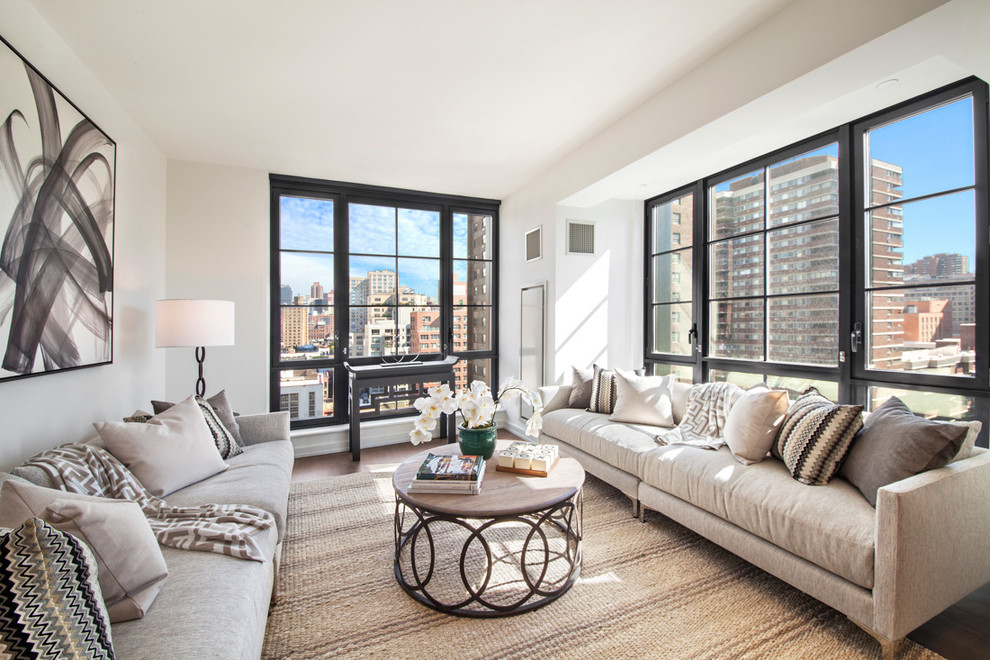 Transitional formal and enclosed dark wood floor and brown floor living room photo in New York with beige walls and no tv