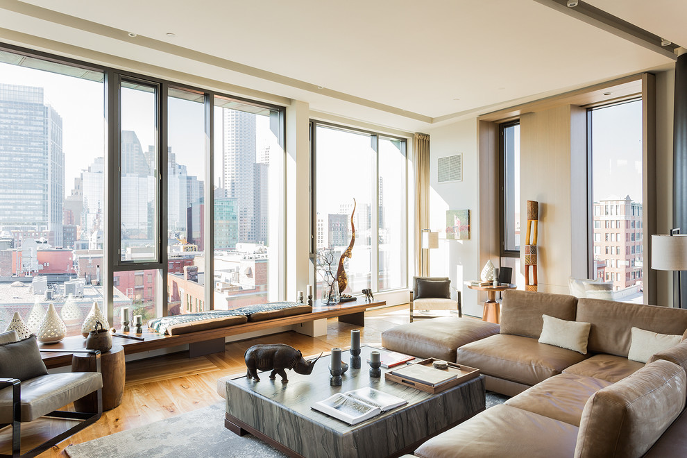 Contemporary open plan living room in Boston with medium hardwood flooring.