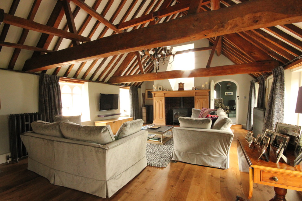 Photo of a country living room in Gloucestershire with medium hardwood flooring.