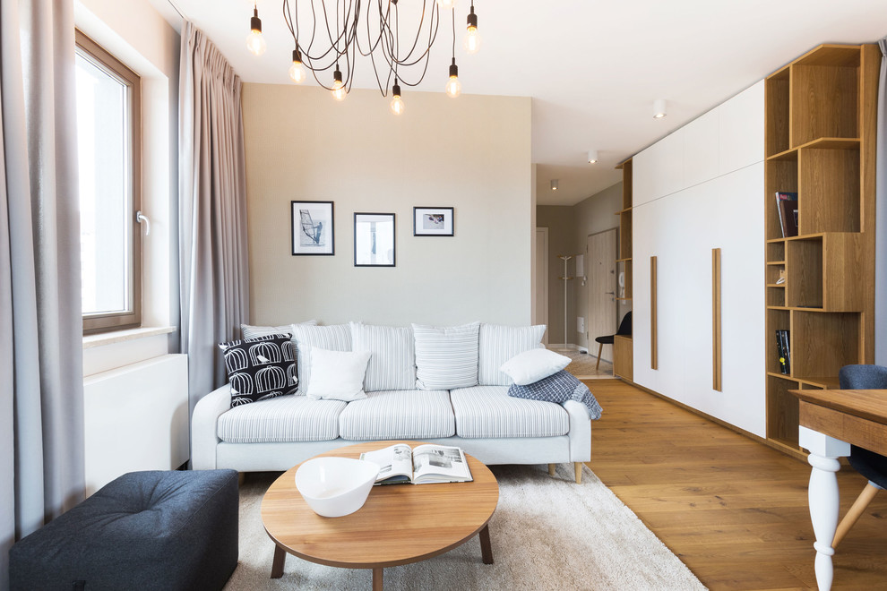 Inspiration för mellanstora minimalistiska separata vardagsrum, med flerfärgade väggar och en fristående TV