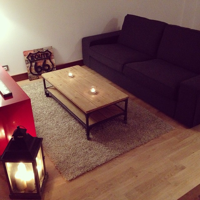 This is an example of a small modern living room in Los Angeles with light hardwood flooring.